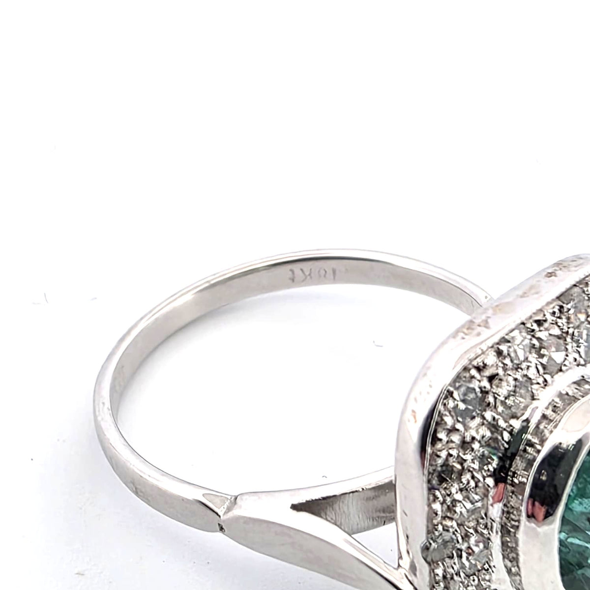 "Entourage" Ring in White Gold, Emerald, and Diamonds