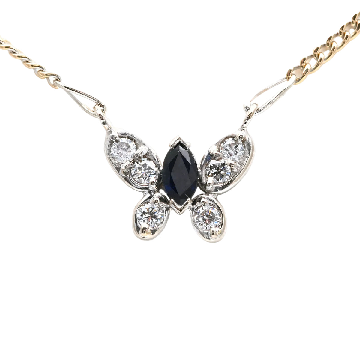 Necklace with a pendant in white gold, yellow gold, sapphire, and diamonds