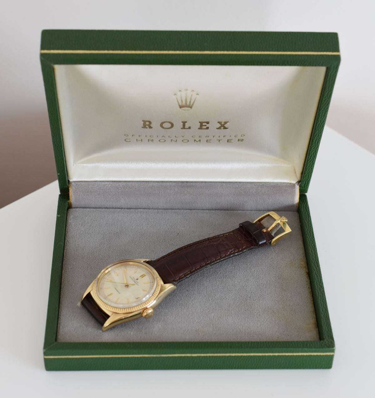 ROLEX "Oyster Perpetual Date Ovettone" watch in yellow gold and leather