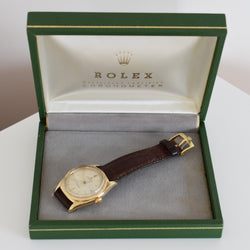 ROLEX "Oyster Perpetual Date Ovettone" watch in yellow gold and leather