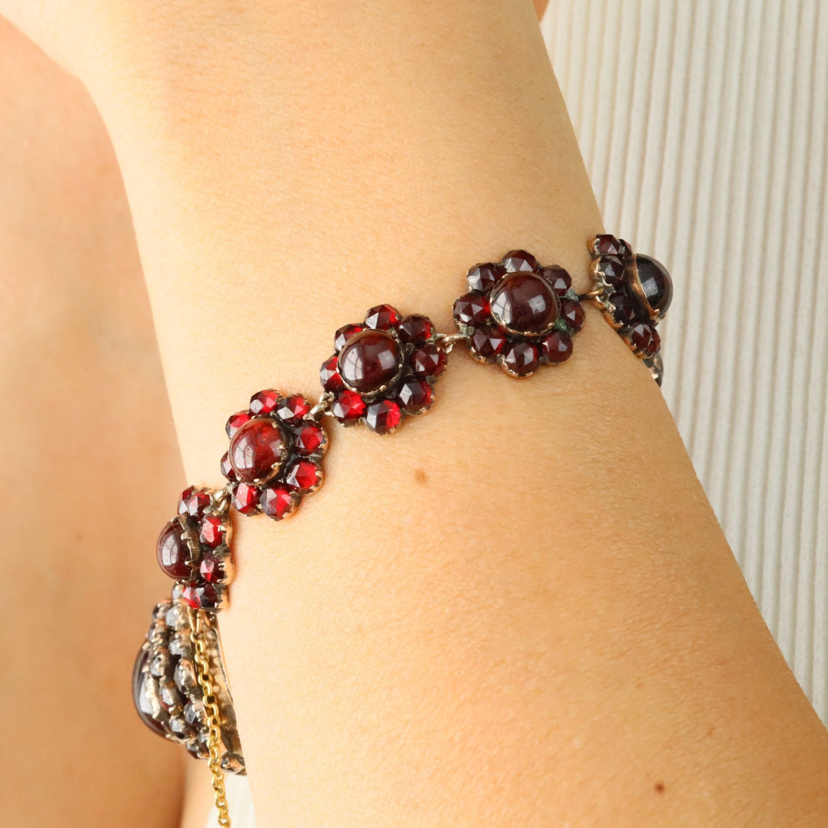 Yellow gold, silver, and garnet bracelet
