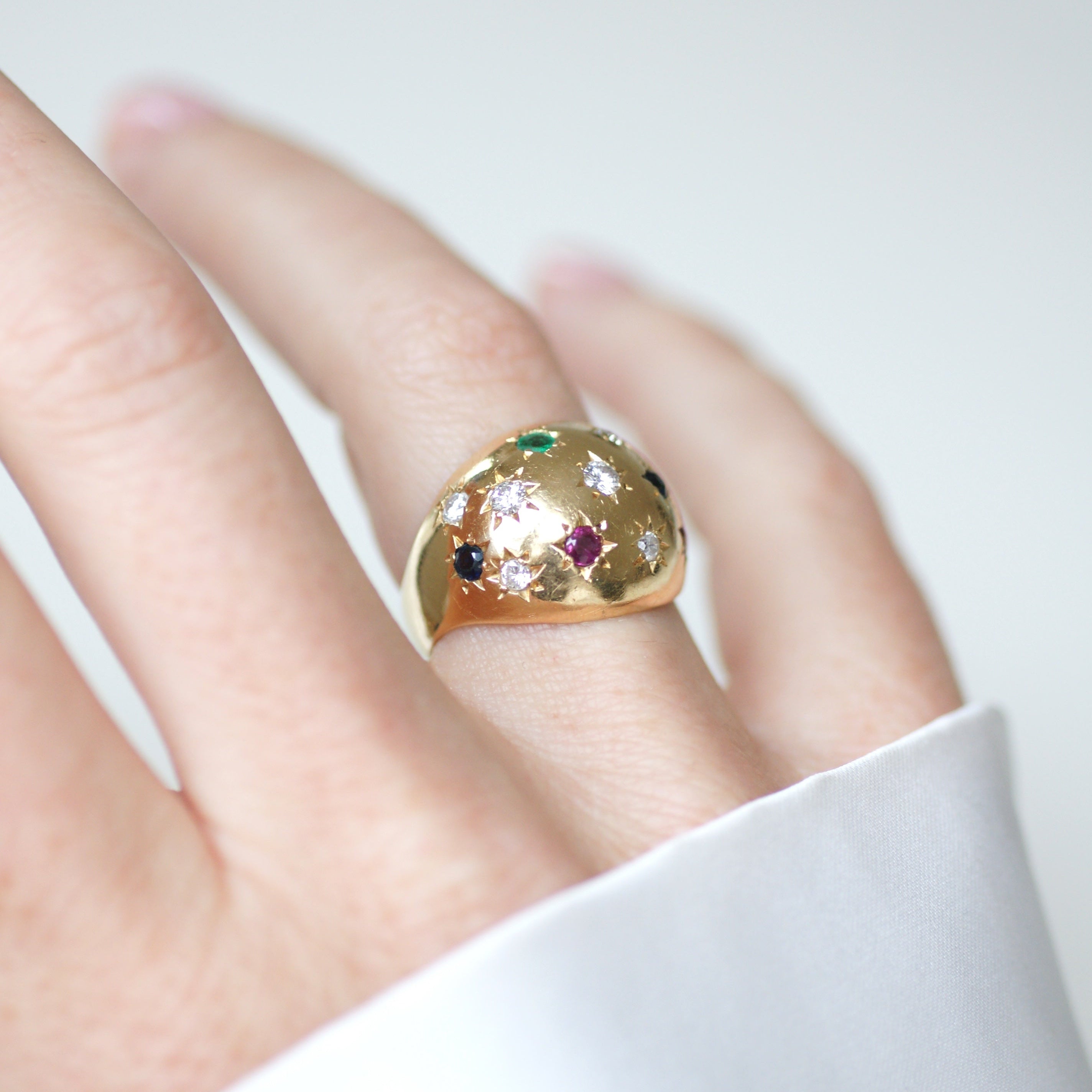 Ring in yellow gold, sapphires, emeralds, rubies, and diamonds