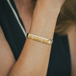HERMÈS bangle in white gold, yellow gold, and diamonds