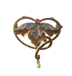 Art Nouveau Brooch Pendant with Rubies, Diamonds, and a Fine Pearl in 18-carat Rose Gold and Platinum