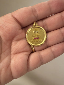 AUGIS Medal in yellow gold, red gemstones, and diamonds
