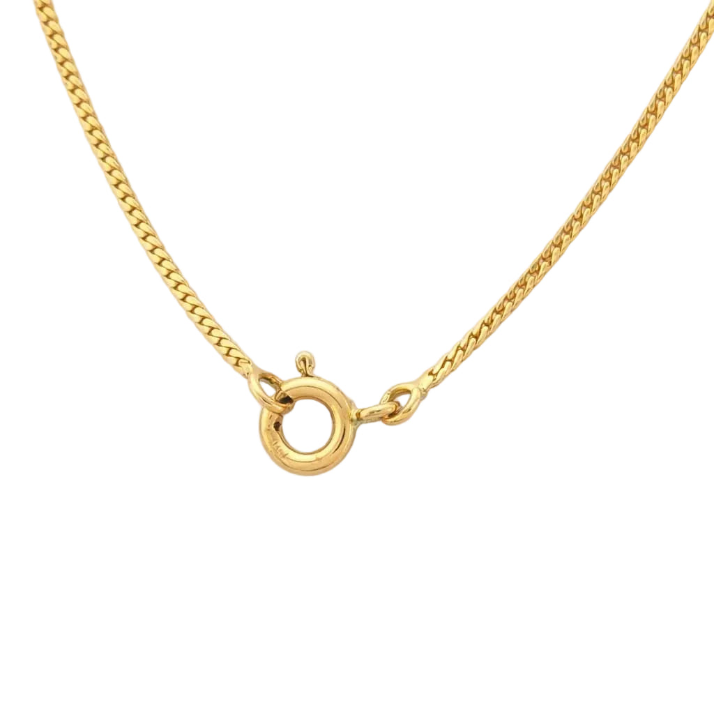 Necklace with a pendant in white gold, yellow gold, emeralds, and diamonds