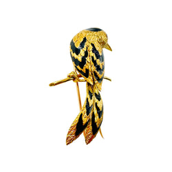 Broche CARTIER Oiseau sur une branche en or jaune, émail et rubis