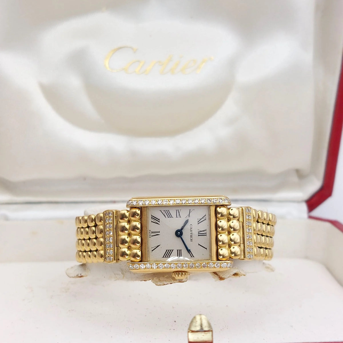 CARTIER "Tank Louis Cartier Mini" watch in yellow gold and diamonds