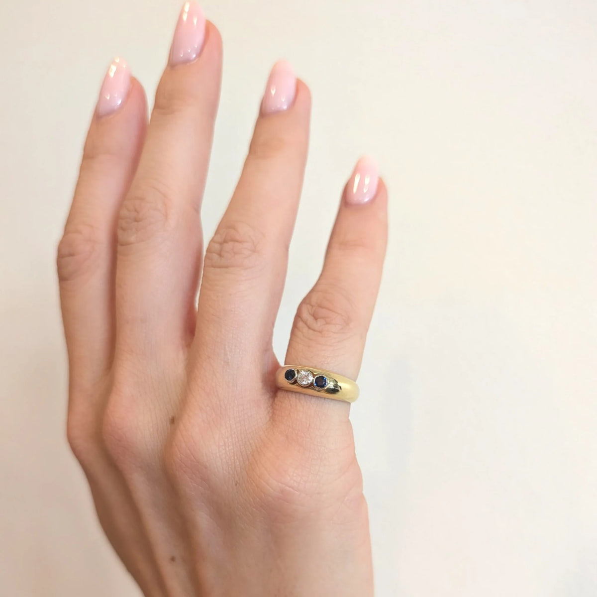 Trilogy Ring in Yellow Gold, Sapphires, and a Diamond
