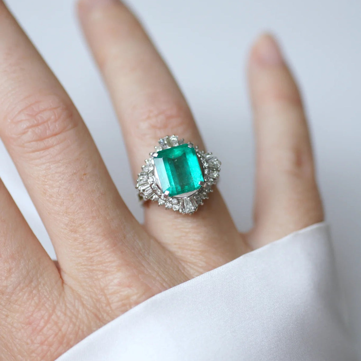 Entourage Ring in Platinum, Emerald, and Diamonds