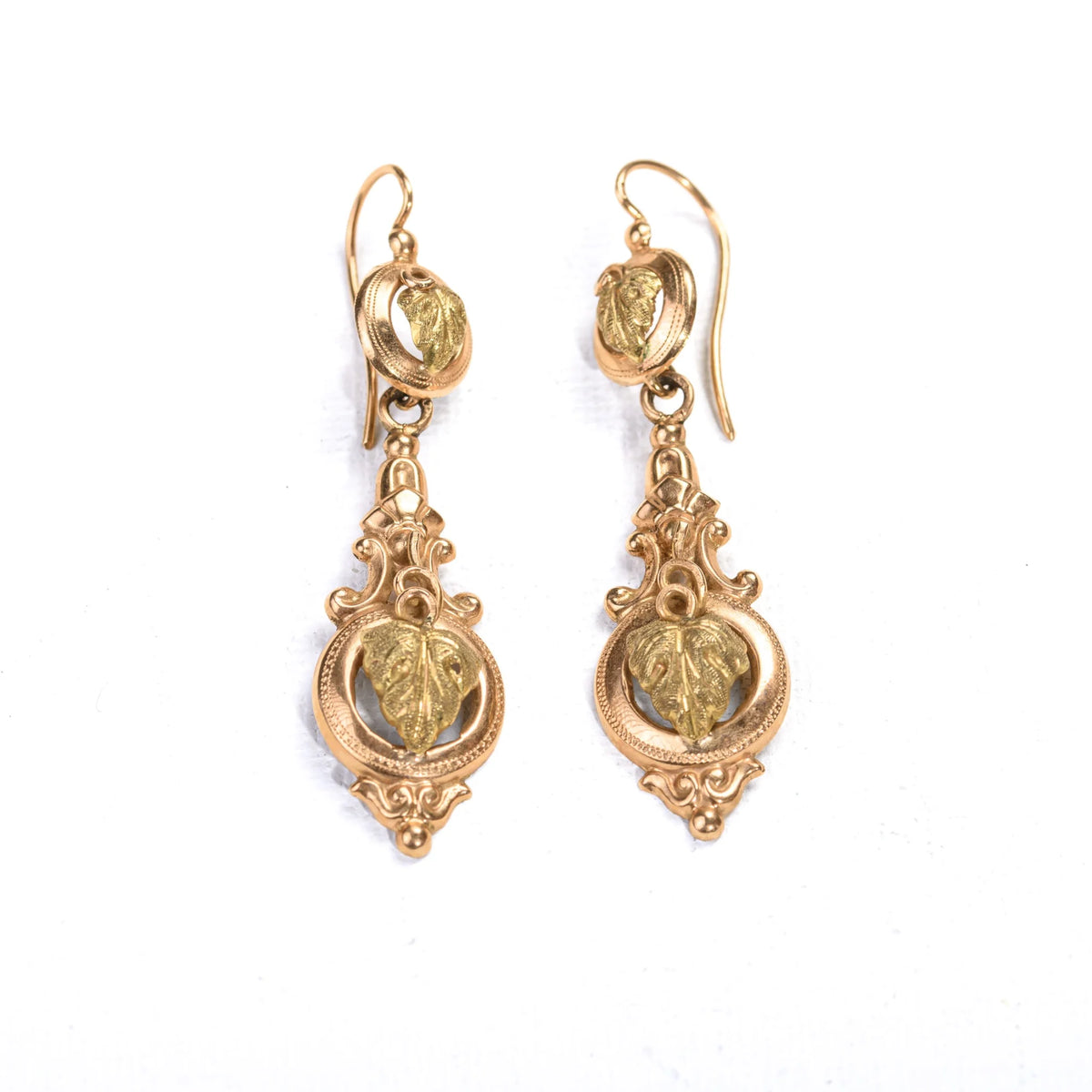 Vintage drop earrings in rose gold and green gold with a vine leaf motif