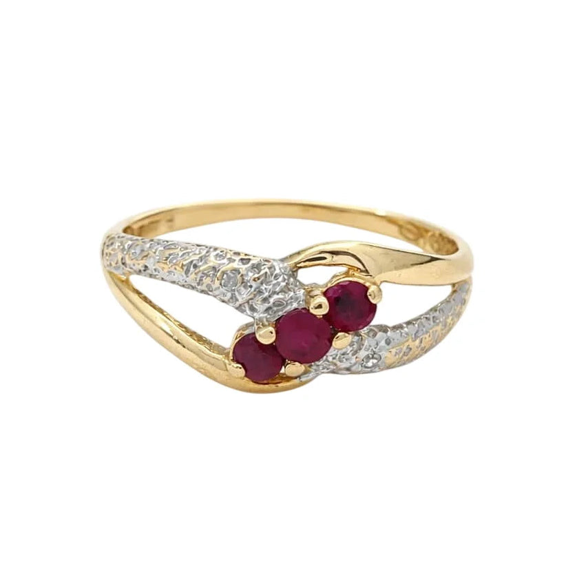 Ring in white gold, yellow gold, rubies, and diamonds