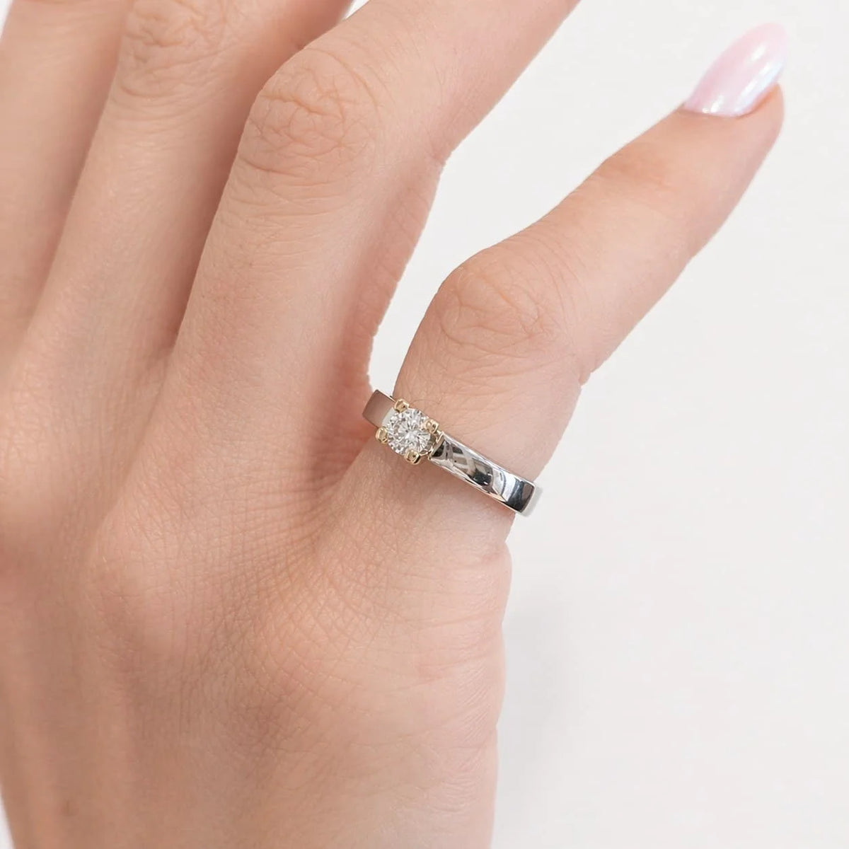 Solitaire Ring in White gold, Yellow gold, and Diamond