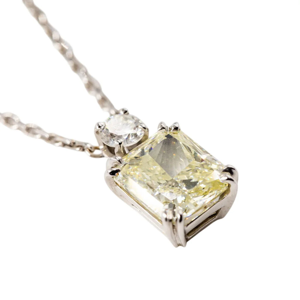 White Gold Necklace with a Pendant Featuring a Fancy Yellow Diamond and a Diamond