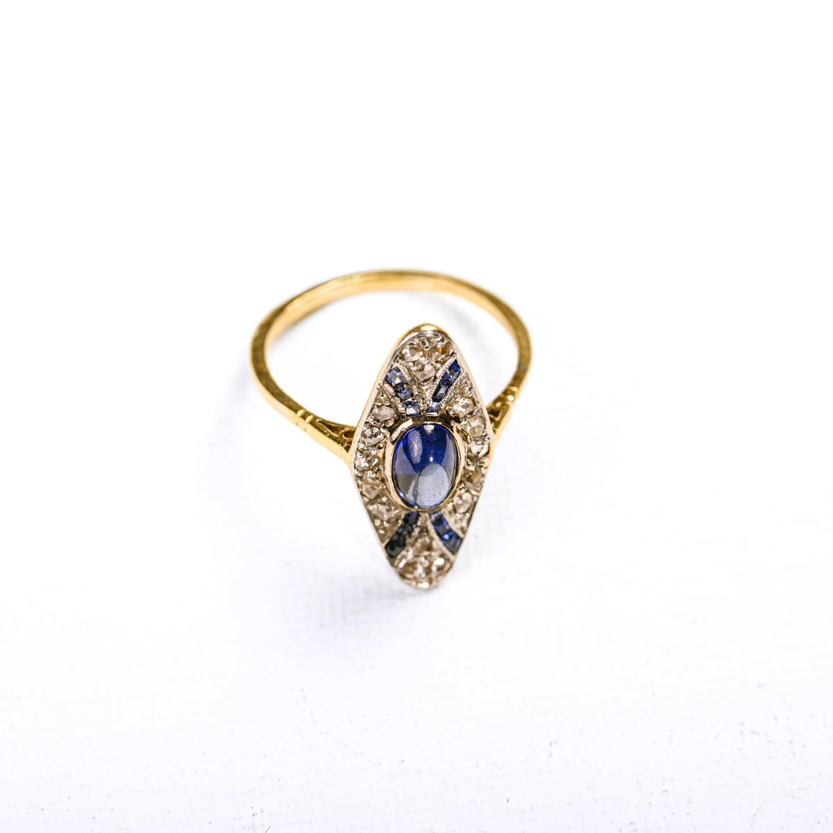 Art Deco marquise ring in multicolored gold, synthetic sapphires, and diamonds