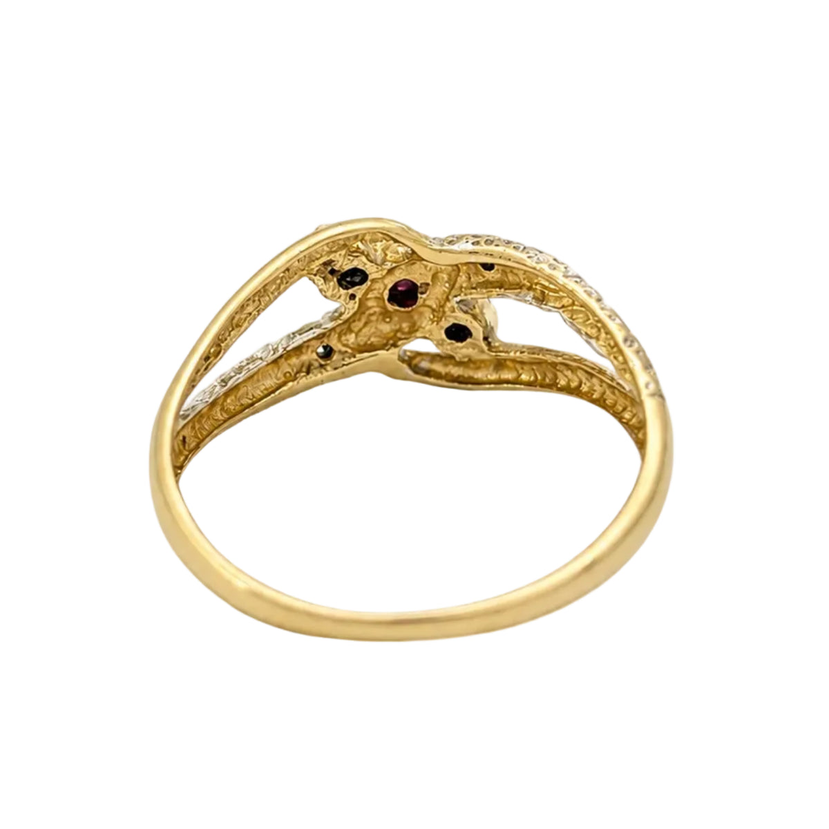 Ring in white gold, yellow gold, rubies, and diamonds
