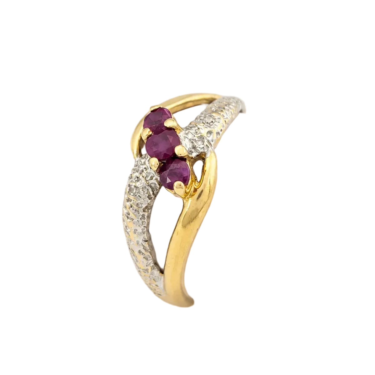 Ring in white gold, yellow gold, rubies, and diamonds
