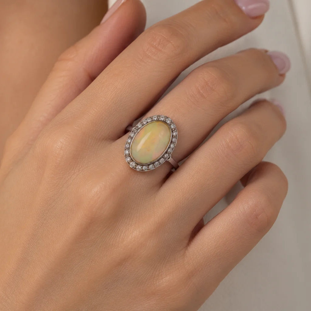 Entourage Ring in white gold, Opal, and Diamonds
