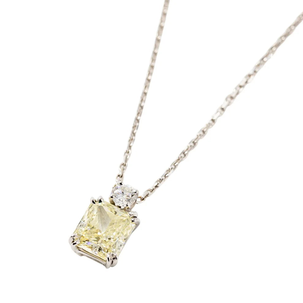 White Gold Necklace with a Pendant Featuring a Fancy Yellow Diamond and a Diamond