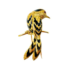 Broche CARTIER Oiseau sur une branche en or jaune, émail et rubis