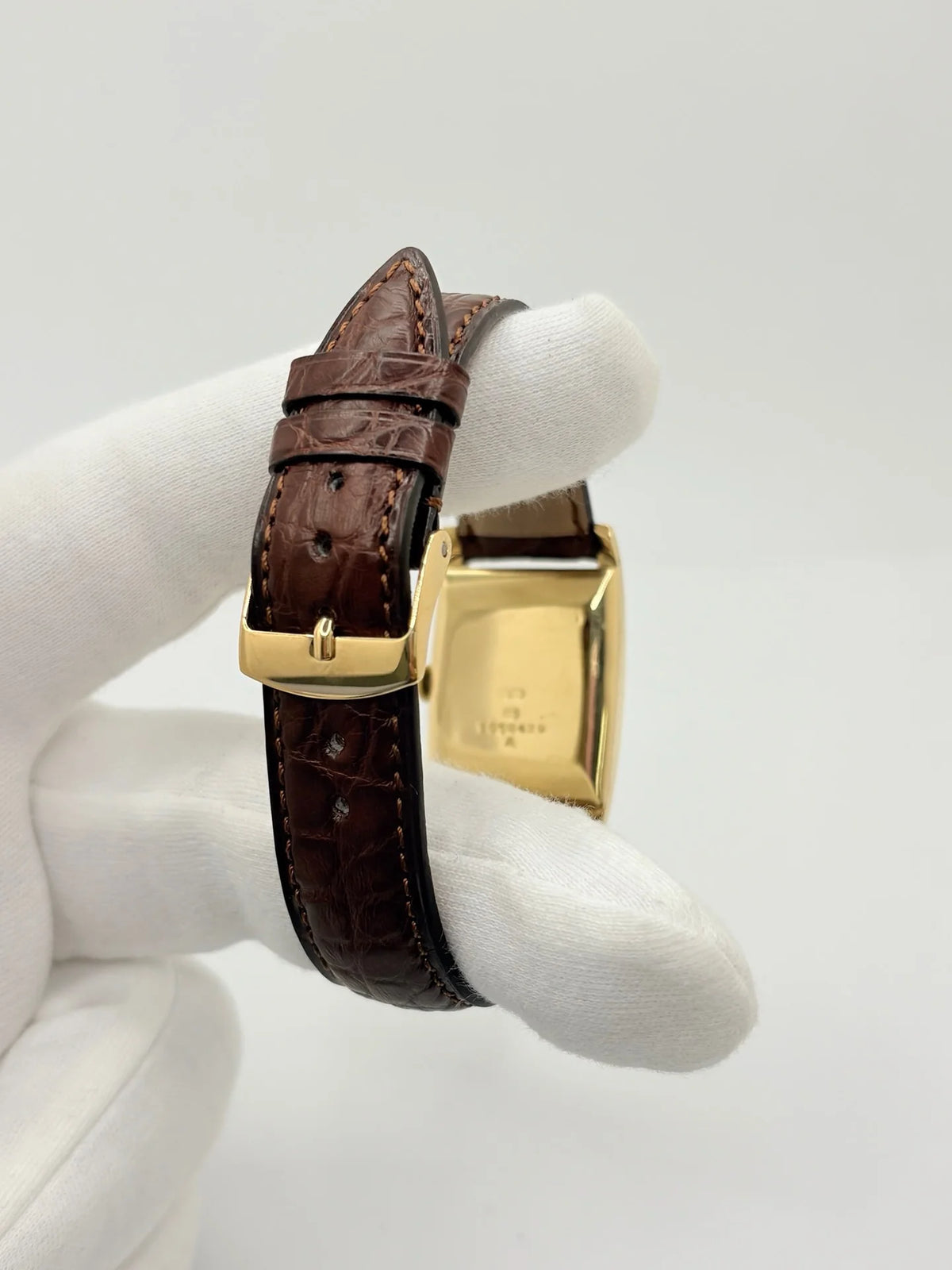 JAEGER-LECOULTRE "Tank Vintage" Watch in yellow gold, stainless steel, and leather