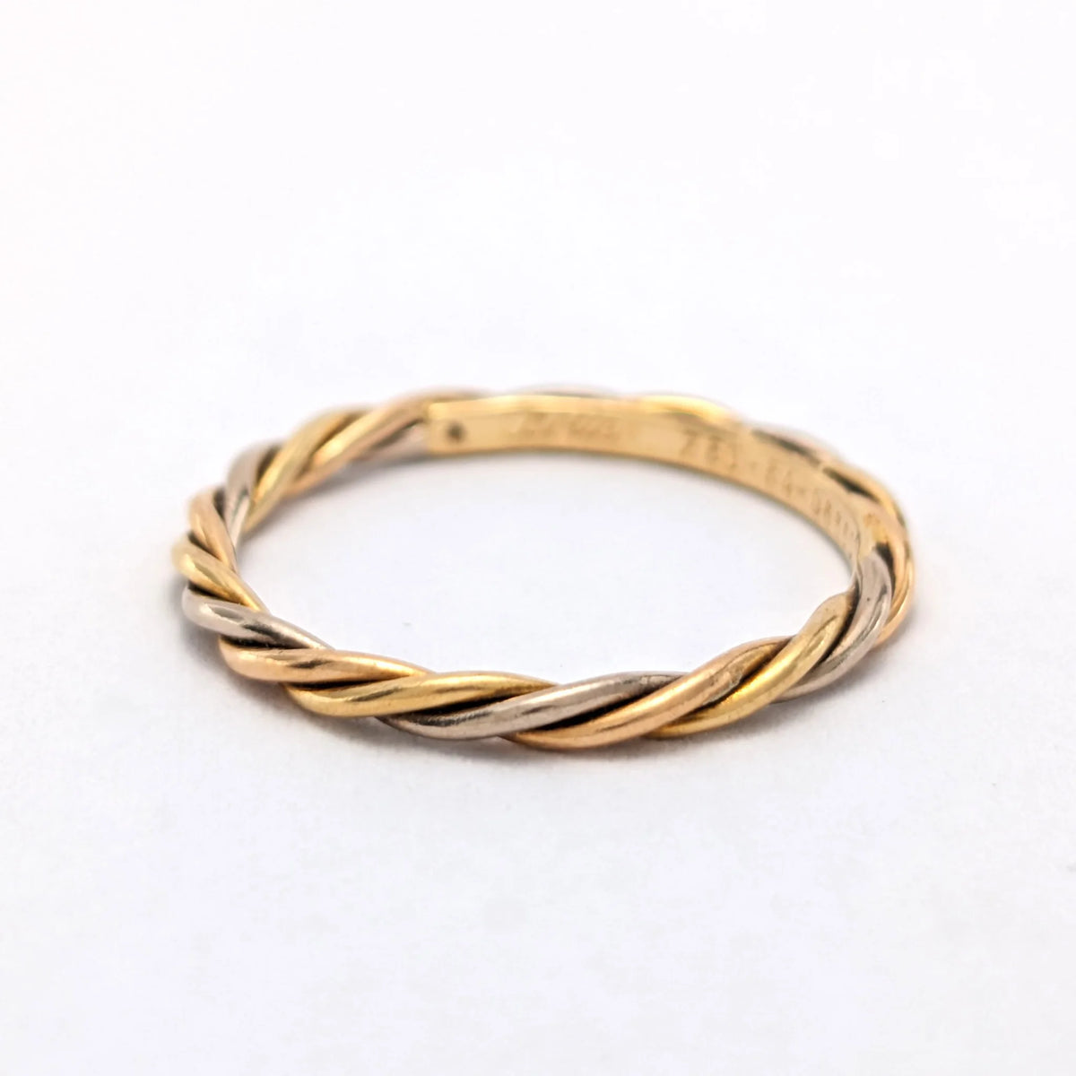 CARTIER Wedding band in white gold, yellow gold, and rose gold