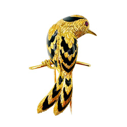Broche CARTIER Oiseau sur une branche en or jaune, émail et rubis