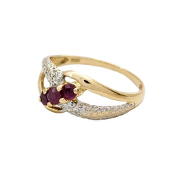 Ring in white gold, yellow gold, rubies, and diamonds