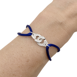 Bracelet Dinh Van "Menottes R10", or blanc, diamants.
