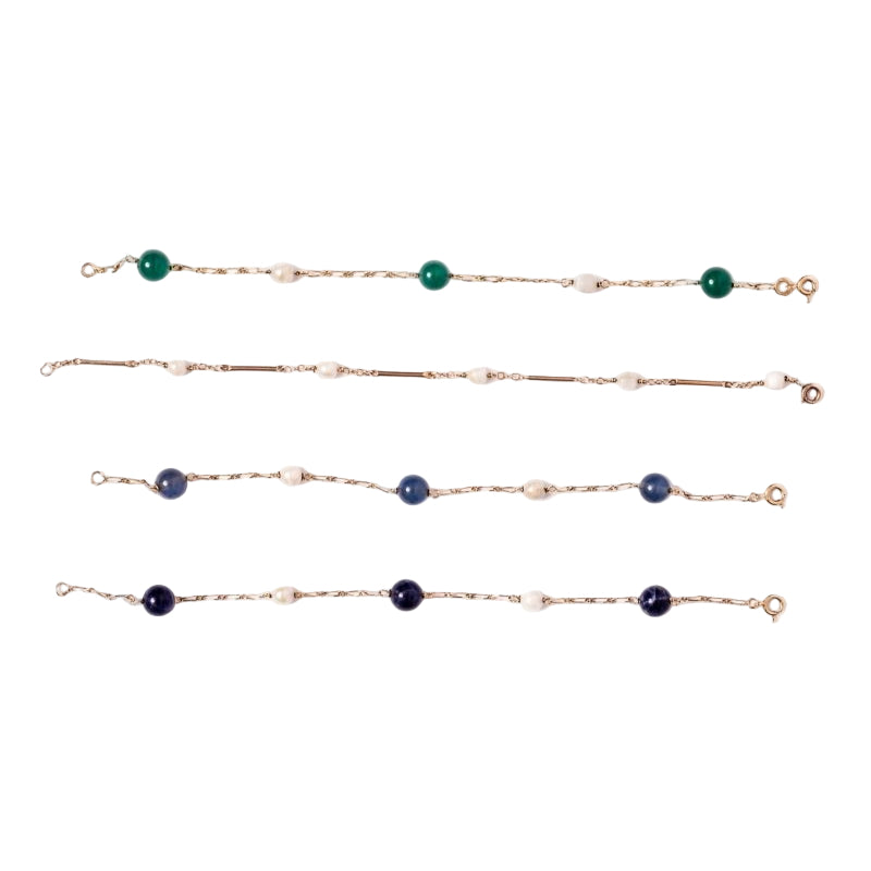 Lot de quatre bracelets en or jaune et perles - Castafiore