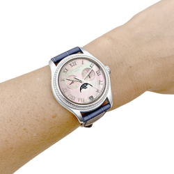 Montre Patek Philippe, "Annual Calendar", or blanc, nacre, diamants.