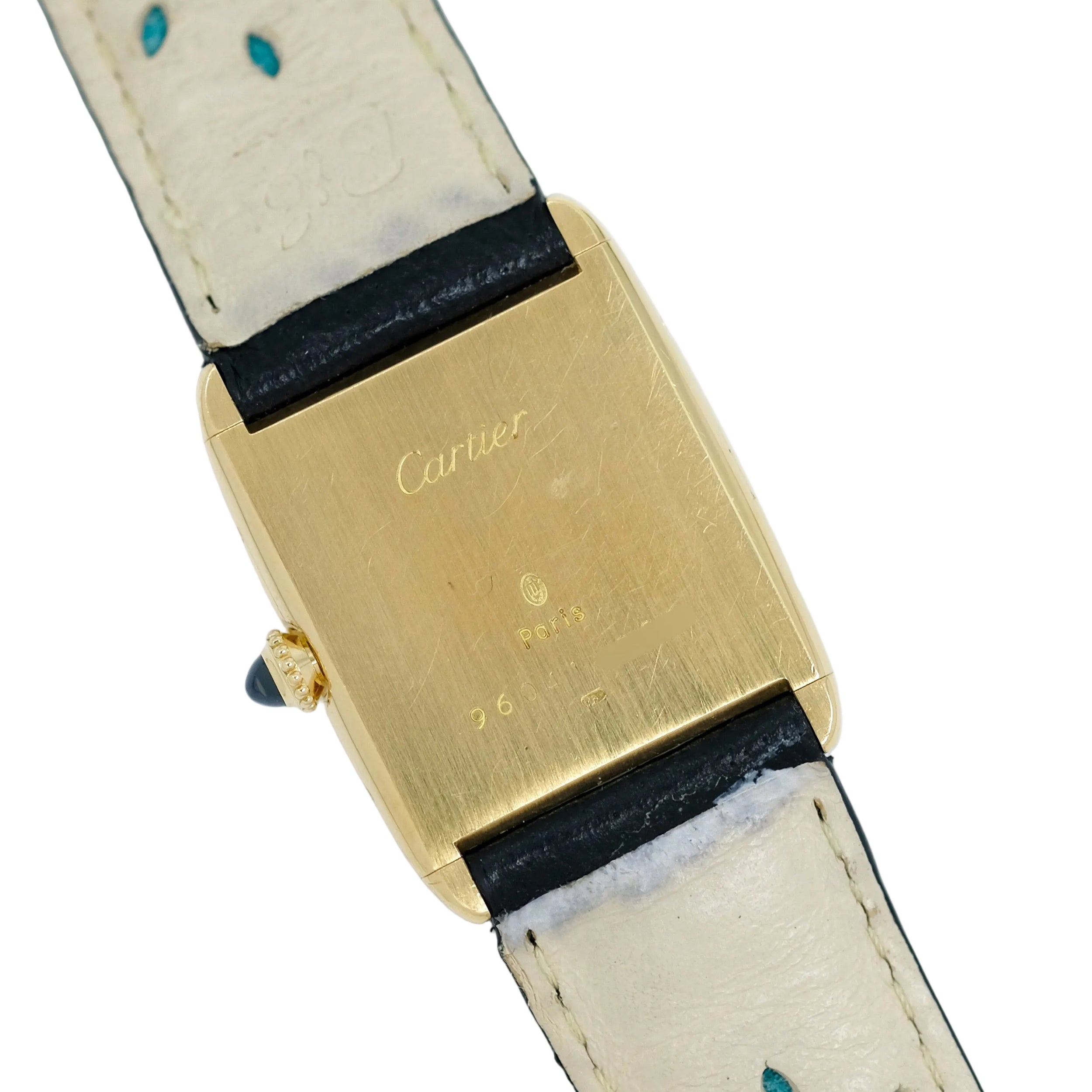 Montre CARTIER "Tank" en or jaune, cuir et saphir