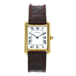 Montre CARTIER Tank Louis en or et saphir