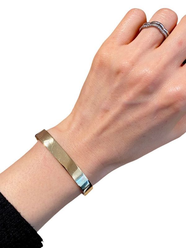 DINH VAN Signed bangle bracelet in 18k yellow gold