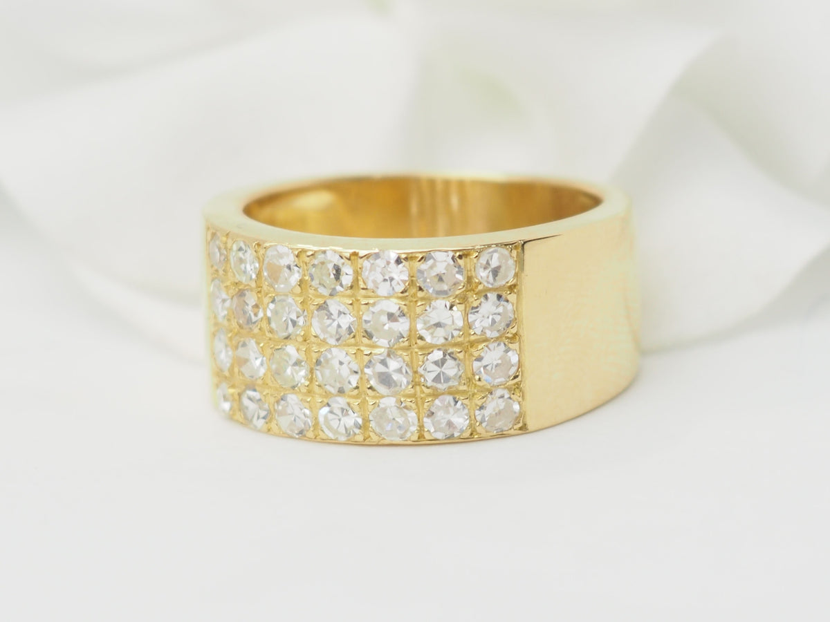 Yellow gold and diamond ribbon ring 