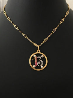 Pendant in yellow gold, paltinium, rubies, pearls and diamonds