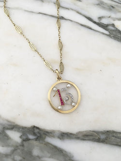 Pendant in yellow gold, paltinium, rubies, pearls and diamonds