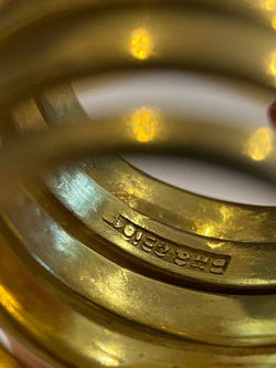 Ring composed of a coiled snake body, in 18k yellow gold