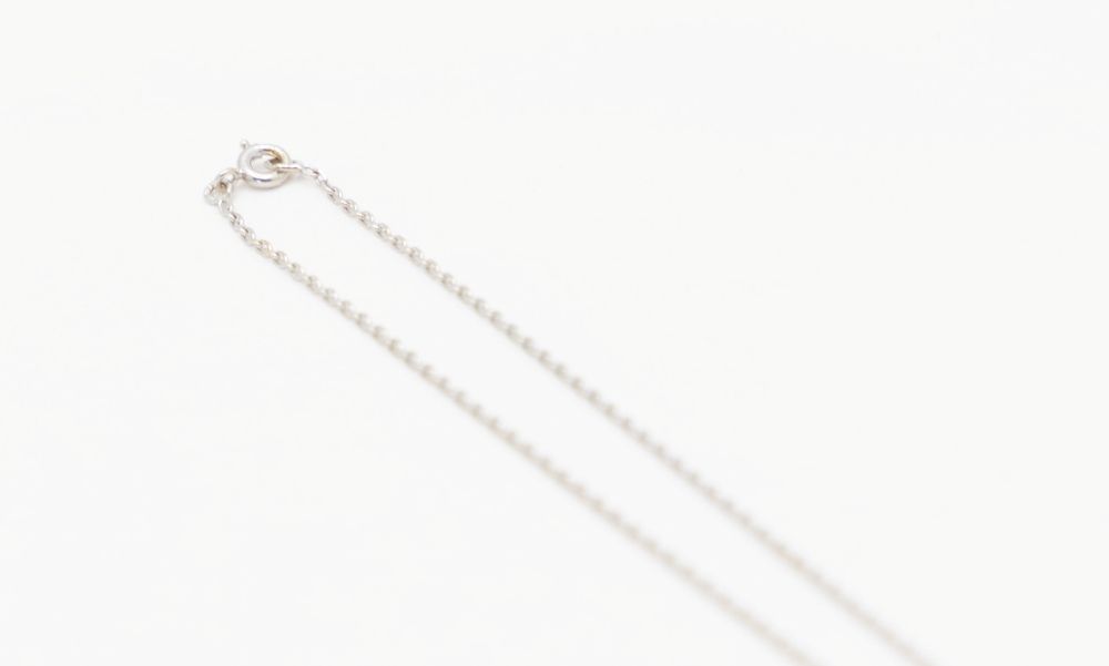 Collier maille forçat en or blanc et diamant