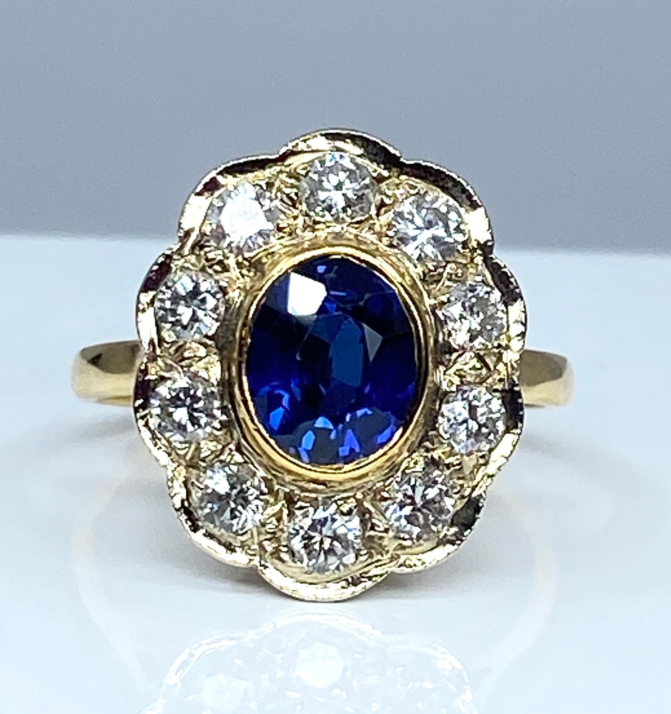 Bague marguerite en or 18 carats en saphir et diamants