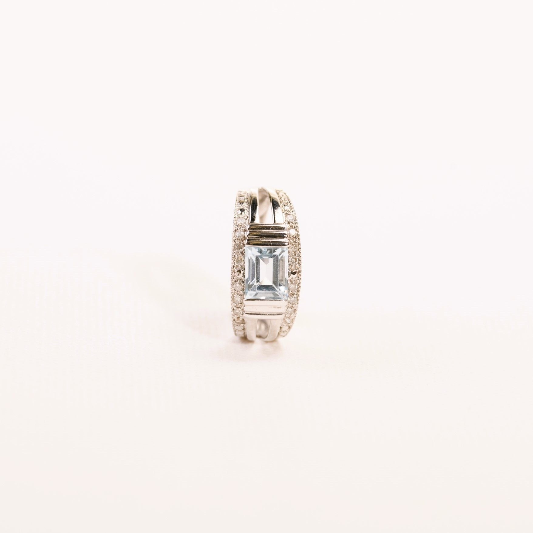 Emerald-cut topaz and diamond band ring in white gold