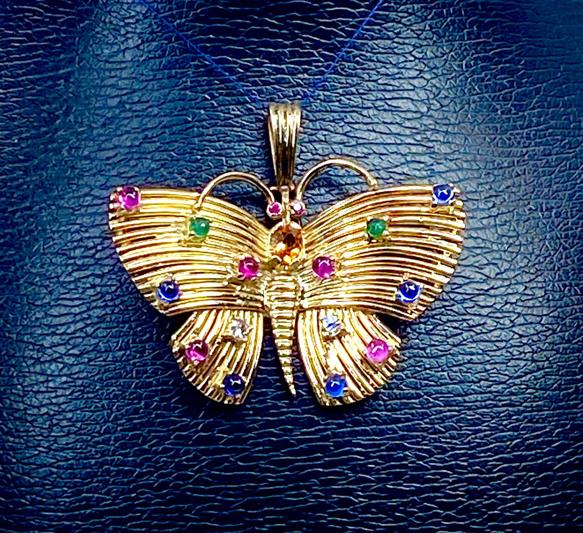 18-carat yellow gold and gemstone butterfly pendant