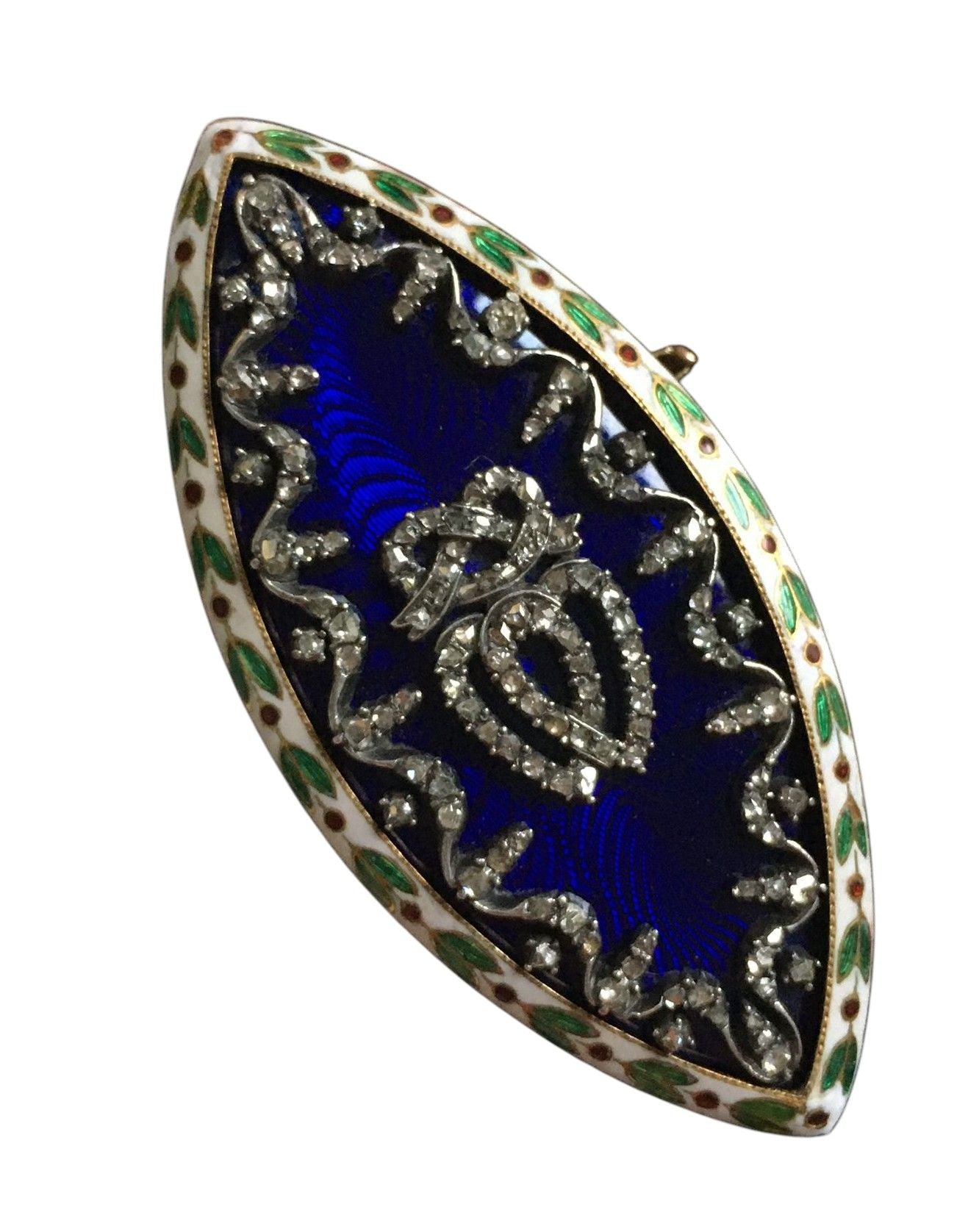 Broche ancienne en forme de navette en or et argent.