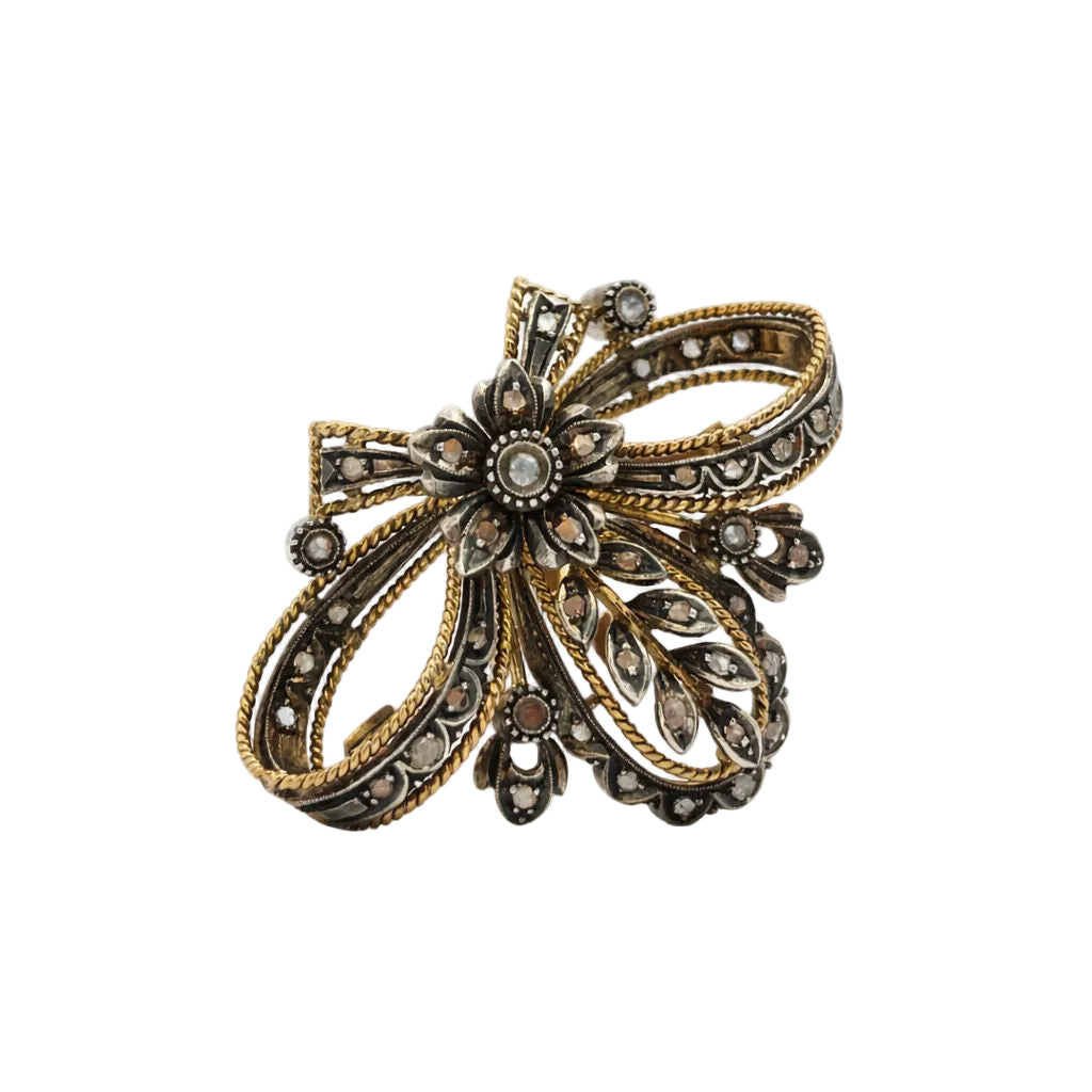 Broche en or jaune, argent et diamant
