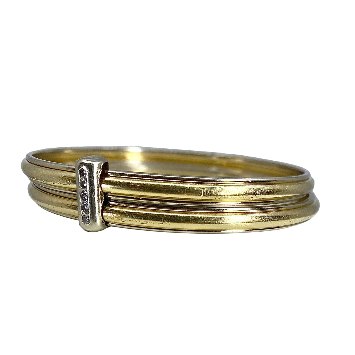 Bracelet double joncs or 18 carats, diamants, Yves Saint Laurent