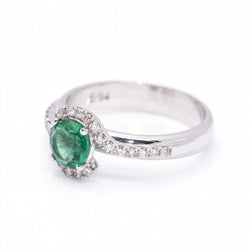 Ring at white gold, emerald and diamonds
