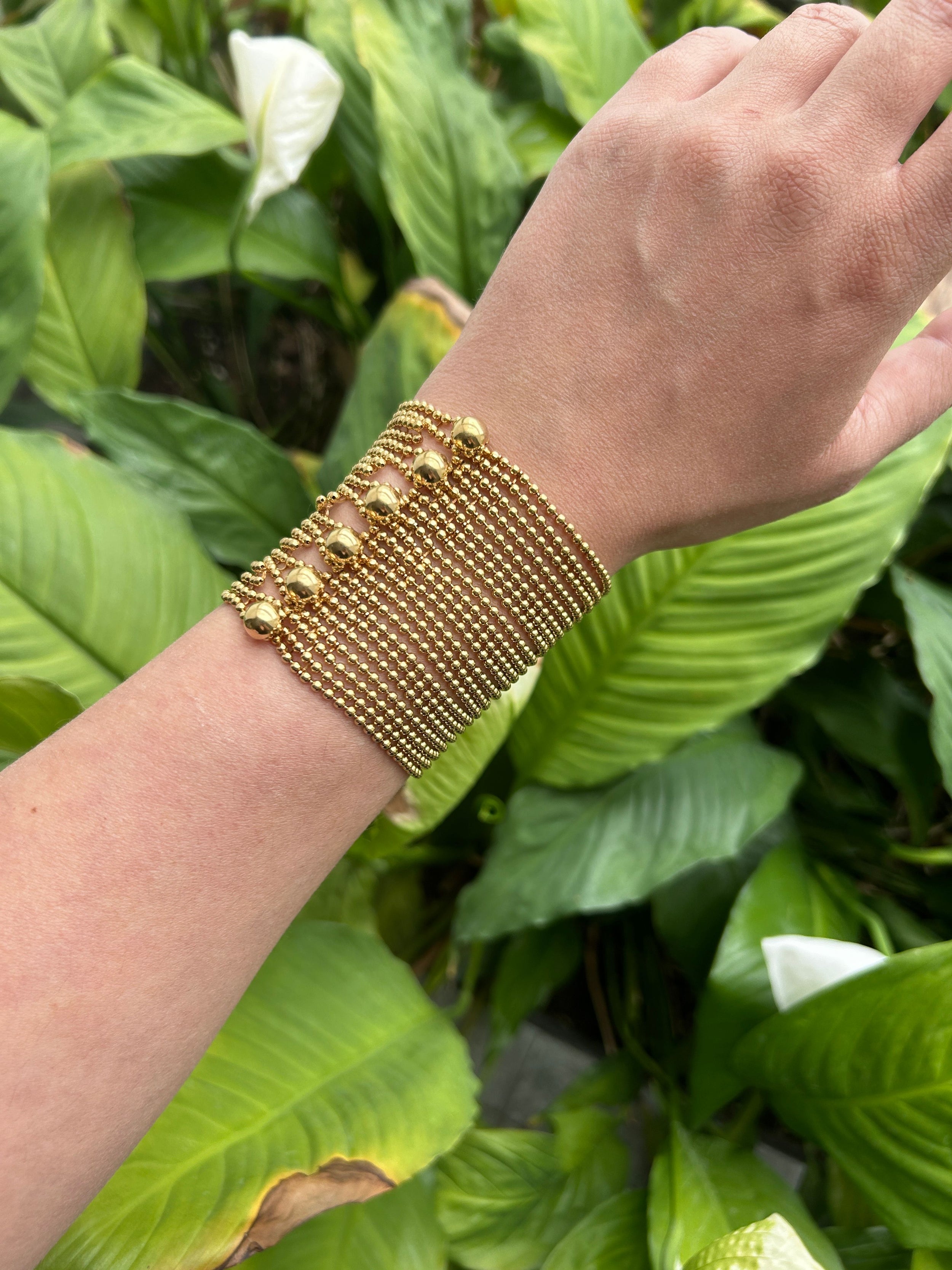 CARTIER Draperie large model cuff bracelet in yellow gold, with its certificate of origin