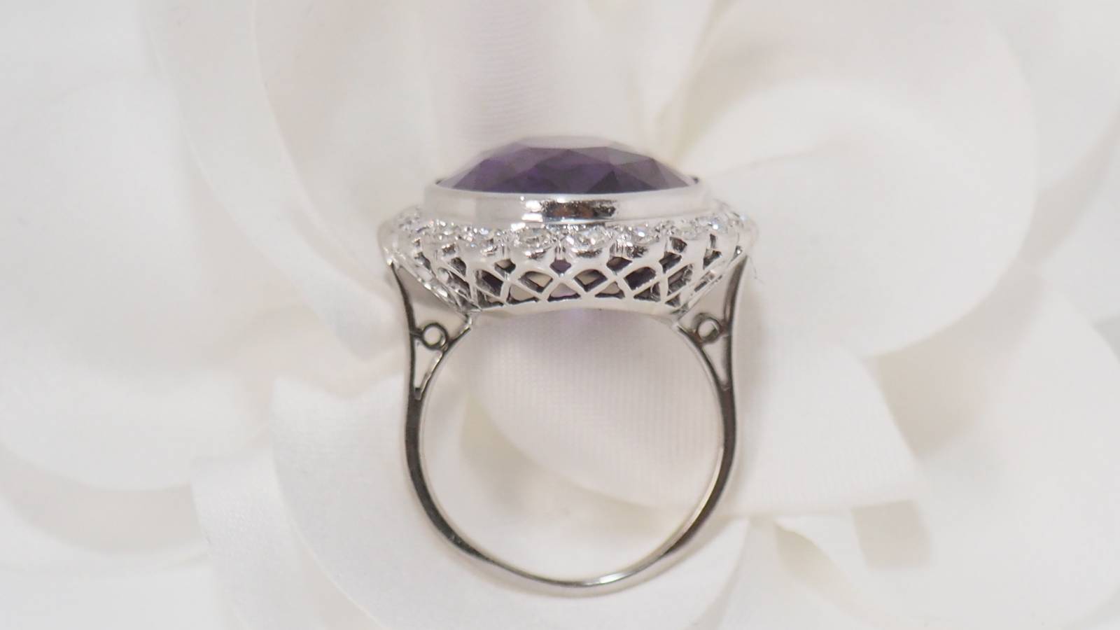 White gold and platinum ring, purple corundum and diamonds 