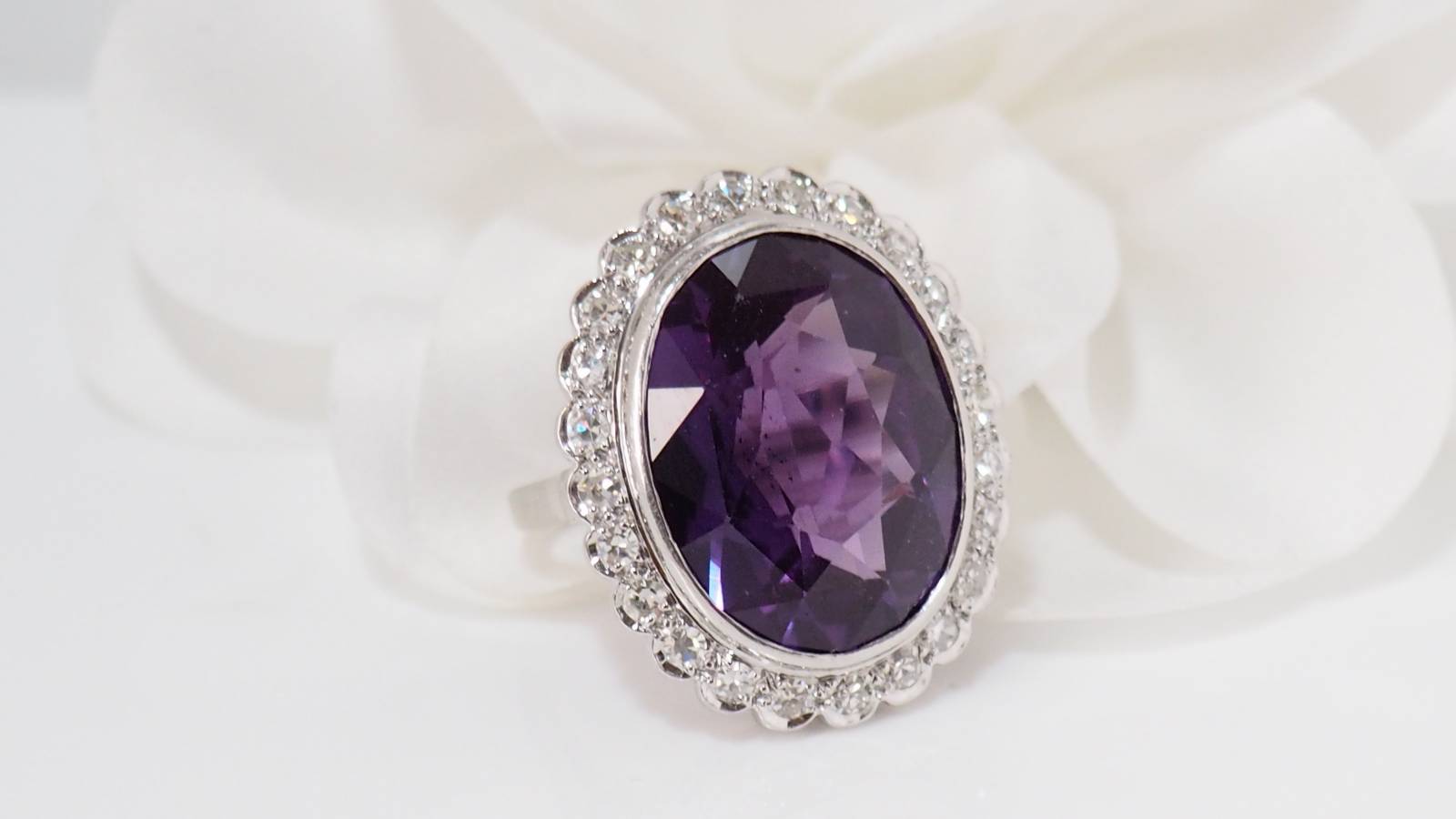 White gold and platinum ring, purple corundum and diamonds 