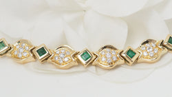 Bracelet in yellow gold, emeralds and diamonds 